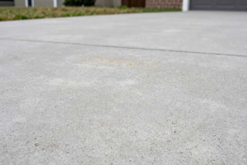 Which stain on concrete is hardest to remove with regular cleaning?